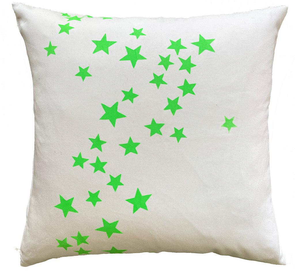 Neon green falling stars on White Denim pillow.